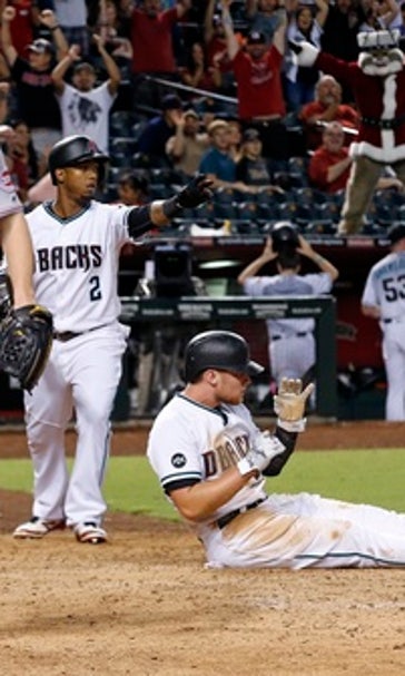 Diamondbacks beat Reds on 2-out wild pitch in 11th
